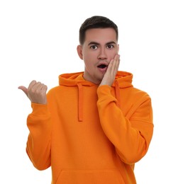 Special promotion. Emotional man pointing at something on white background