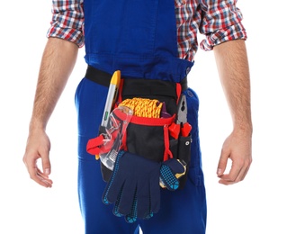 Photo of Construction worker with tool belt on white background, closeup