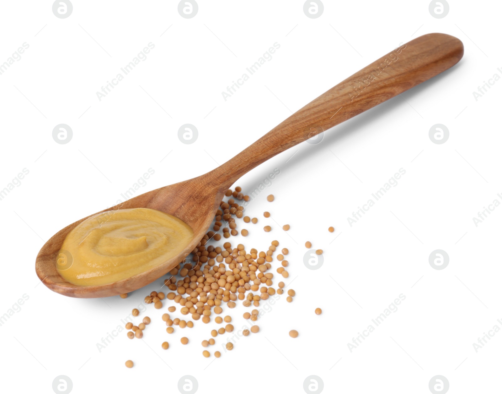 Photo of Fresh tasty mustard sauce in spoon and dry seeds isolated on white