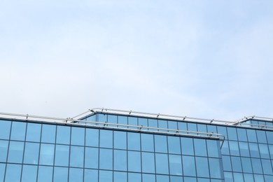 Photo of Modern building against blue sky. Urban architecture