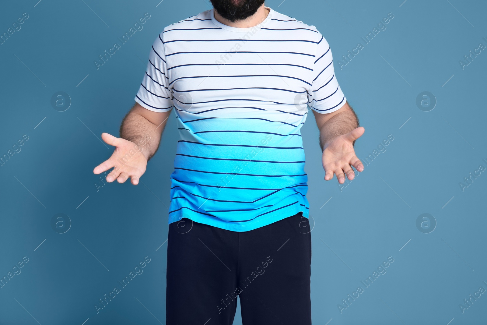 Photo of Overweight man on color background