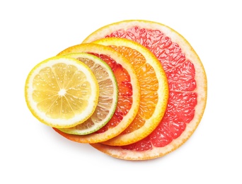 Photo of Slices of fresh citrus fruits on white background, top view