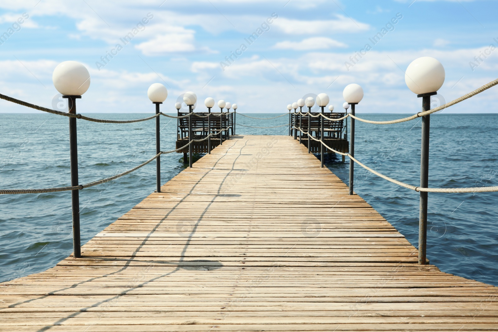 Photo of Beautiful river scene with wooden pier on sunny day