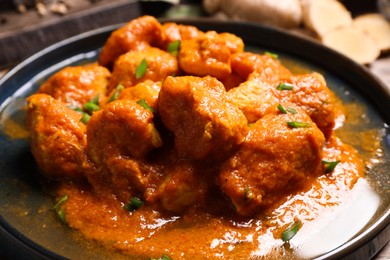 Plate of delicious chicken curry, closeup view