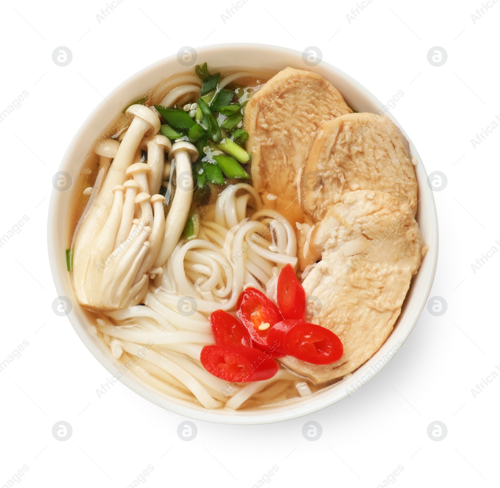 Photo of Delicious ramen with meat and mushrooms in bowl isolated on white, top view. Noodle soup