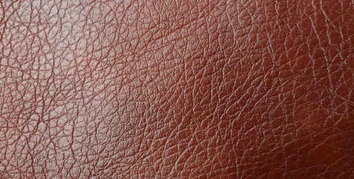 Texture of brown leather as background, top view