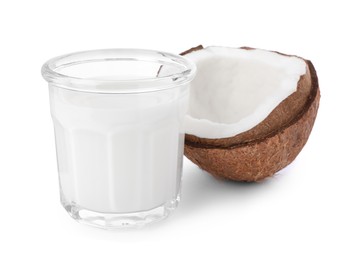 Glass of delicious vegan milk and coconut on white background
