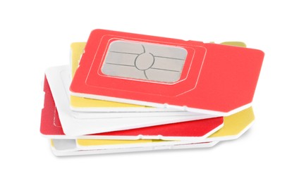 Photo of Stack of different SIM cards on white background