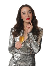 Photo of Christmas celebration. Beautiful young woman in stylish dress with glass of champagne isolated on white