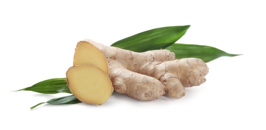 Photo of Cut fresh ginger and leaves isolated on white