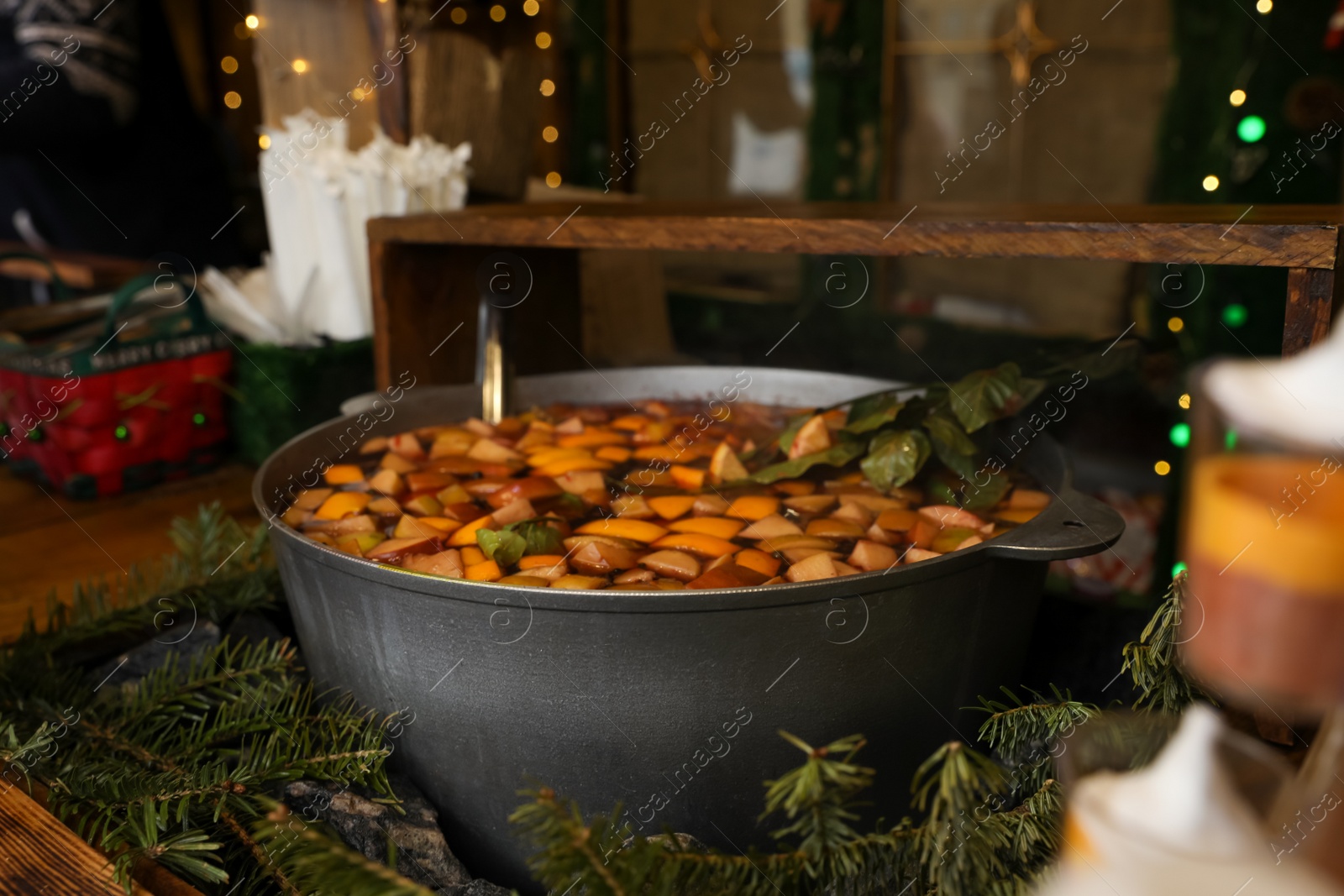 Photo of Big pot with mulled wine at Christmas fair stall