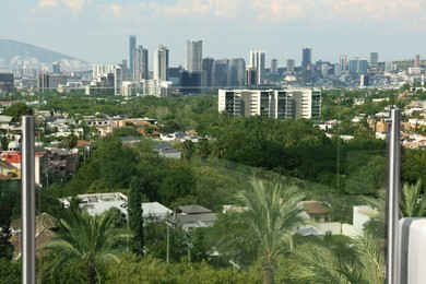 Photo of Picturesque view of city and green trees