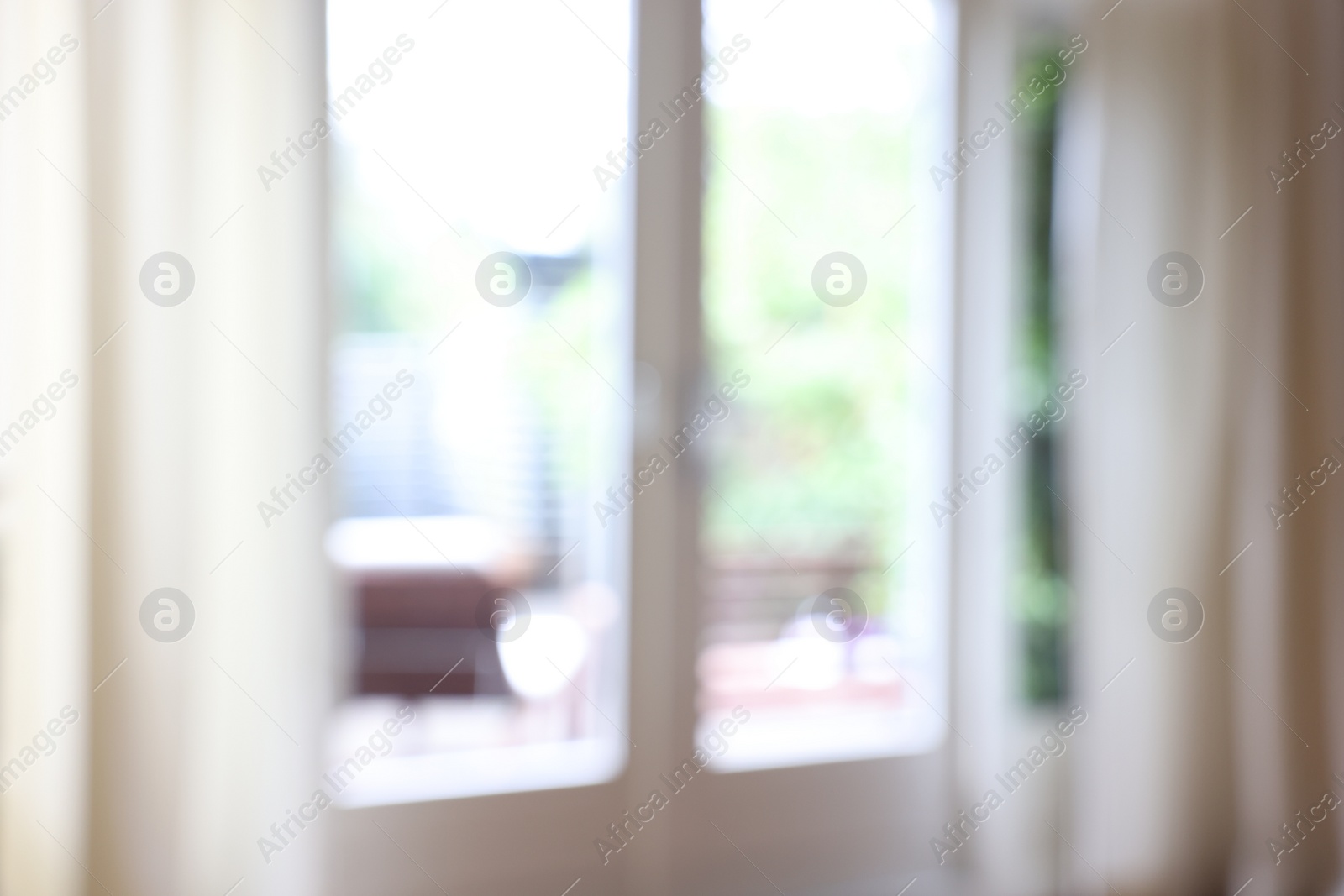 Photo of Blurred view of glass door at home