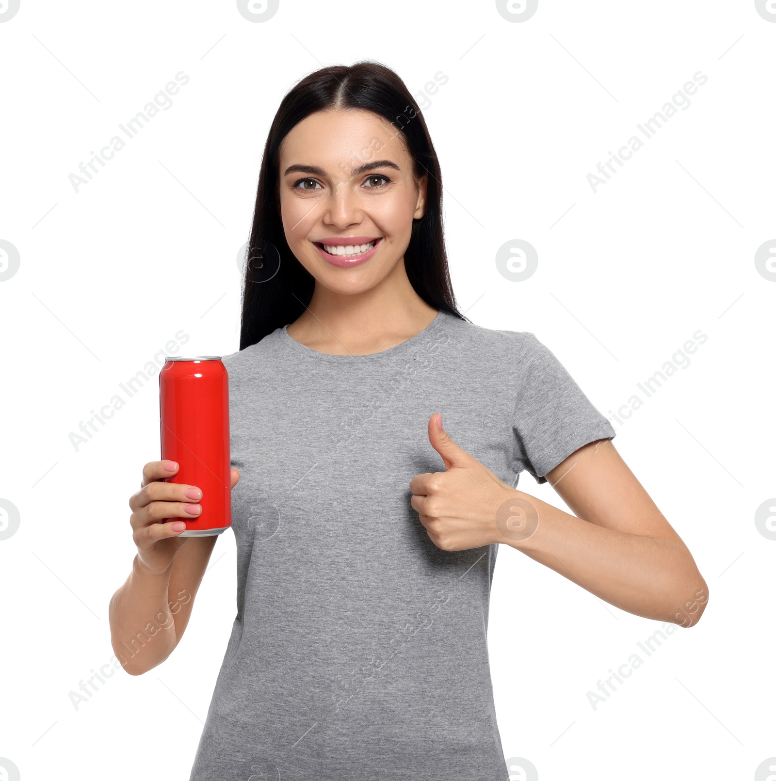 Photo of Beautiful happy woman holding red beverage can and showing thumbs up on white background