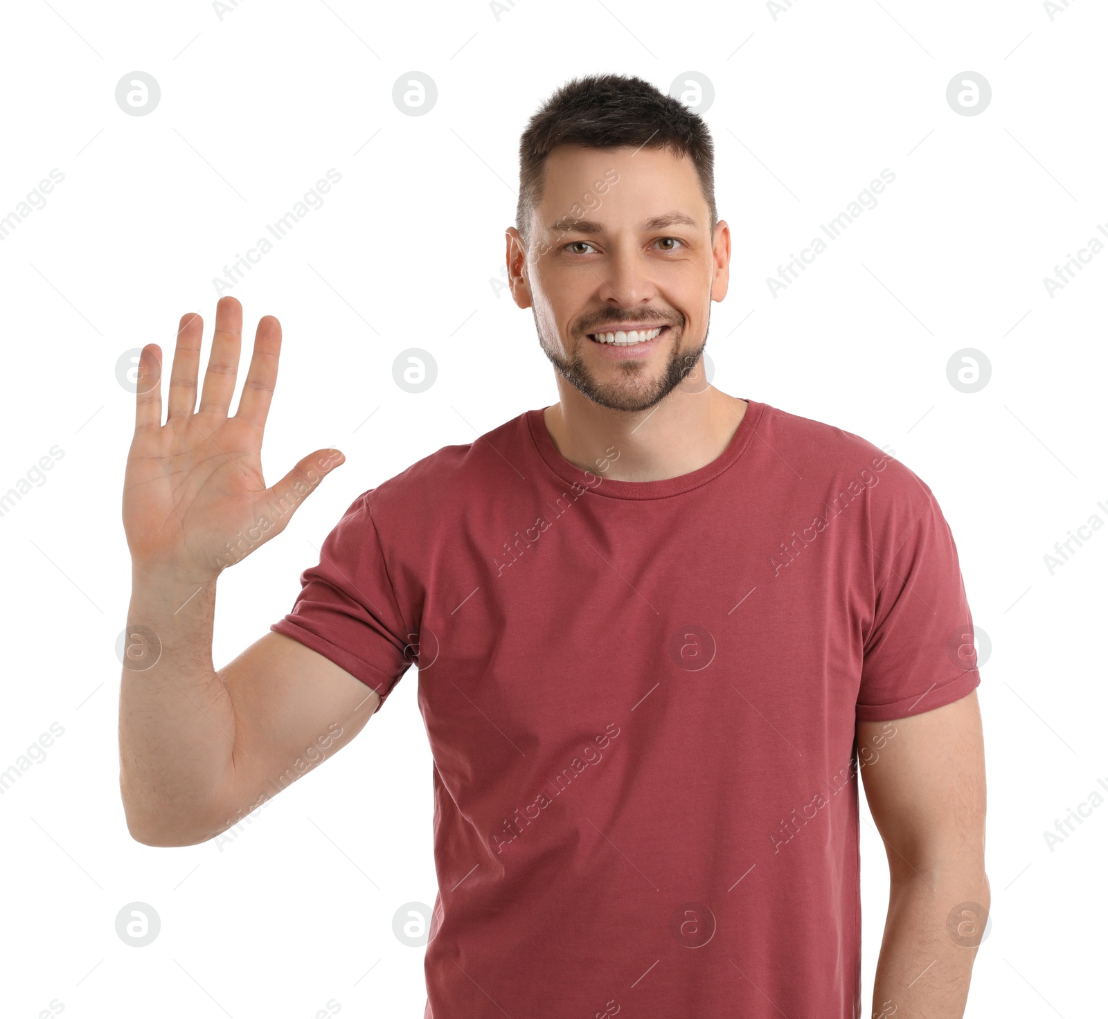 Photo of Cheerful man waving to say hello on white background