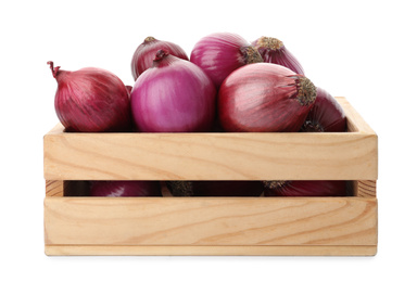 Ripe red onions in wooden crate isolated on white