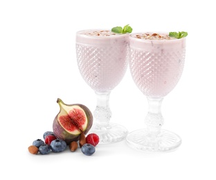 Photo of Delicious fig smoothies and ingredients on white background