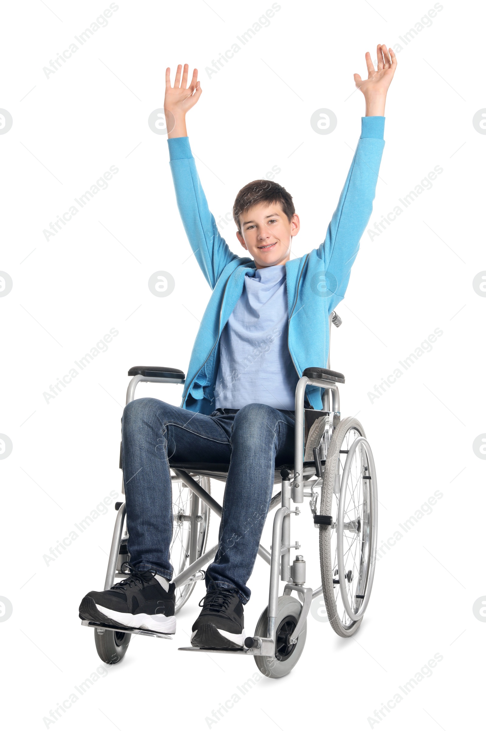 Photo of Teenage boy in wheelchair on white background