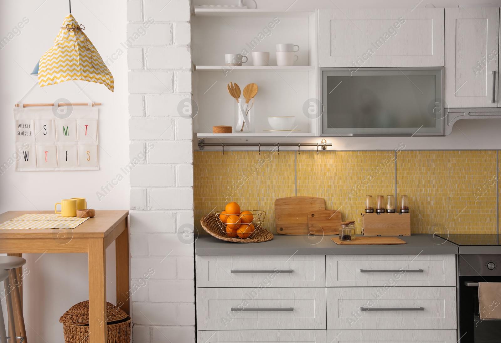 Photo of Modern kitchen interior with stylish wooden table