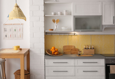 Modern kitchen interior with stylish wooden table