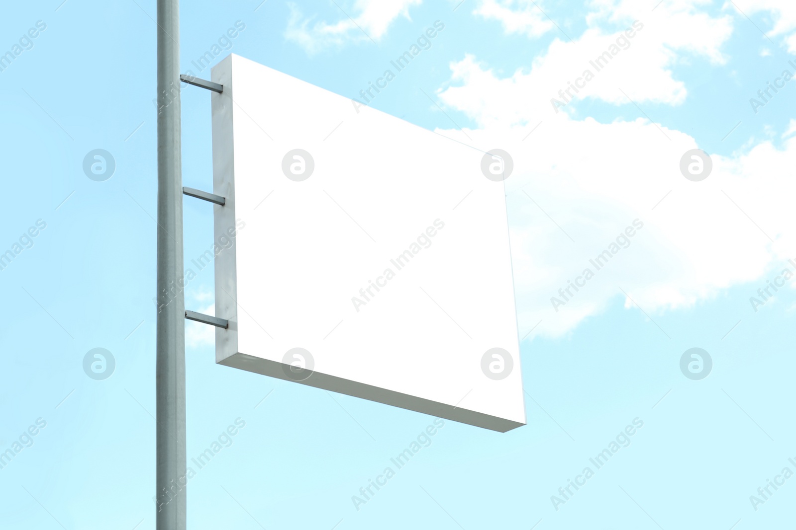 Photo of Blank lightbox signage against blue sky. Advertising board design