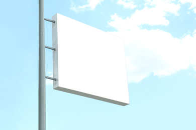 Blank lightbox signage against blue sky. Advertising board design