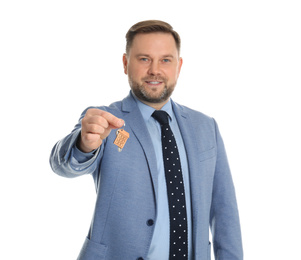 Real estate agent holding key on white background