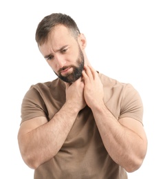 Photo of Young man suffering from sore throat on white background