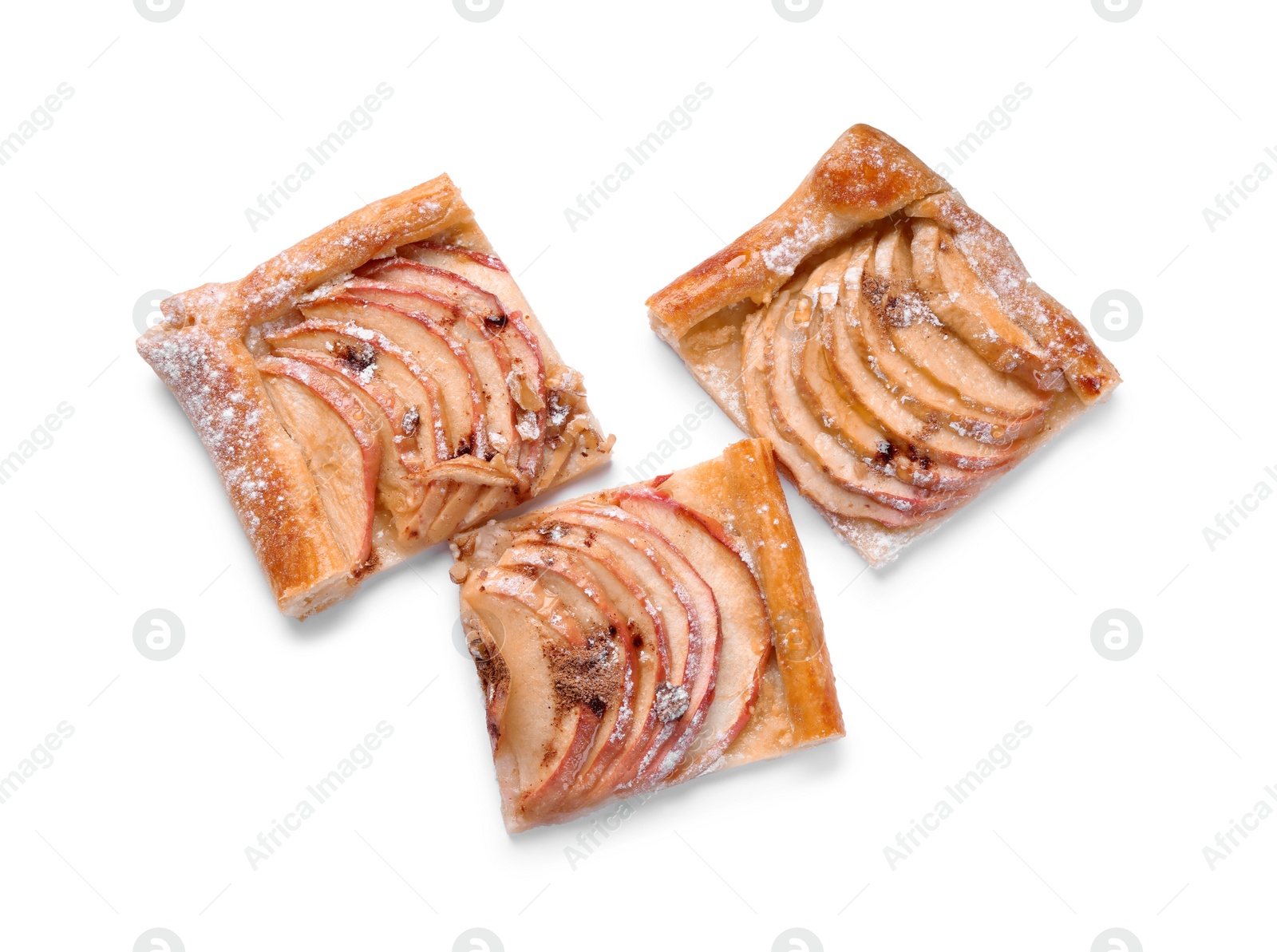 Photo of Pieces of delicious apple pie with powdered sugar isolated on white, top view