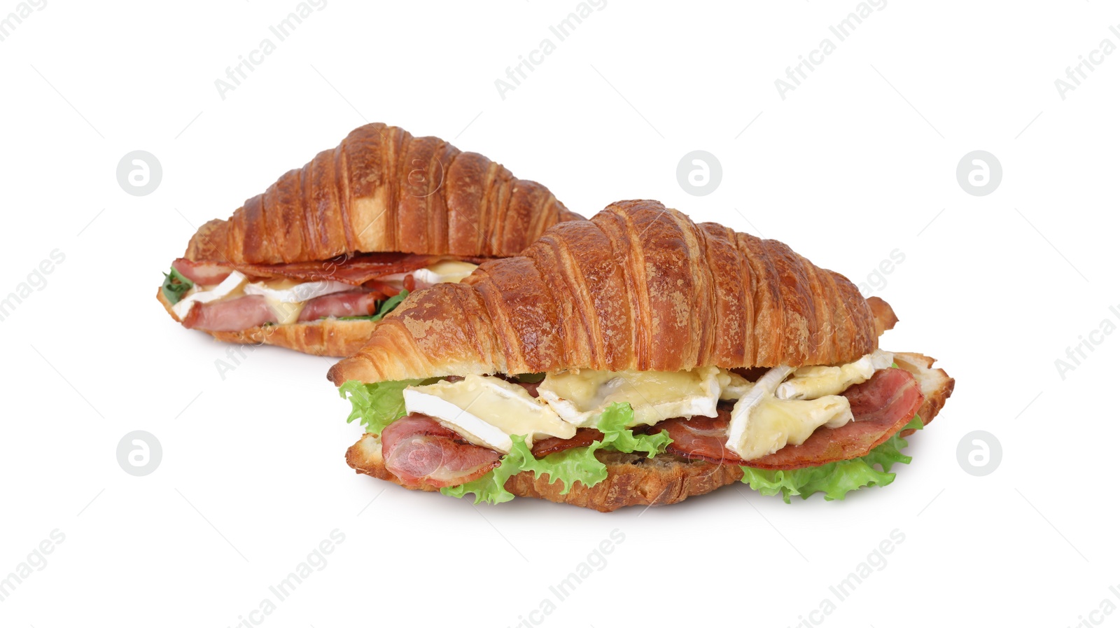 Photo of Tasty croissants with brie cheese, ham and bacon isolated on white