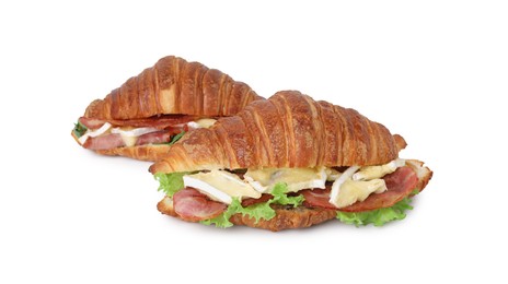 Tasty croissants with brie cheese, ham and bacon isolated on white