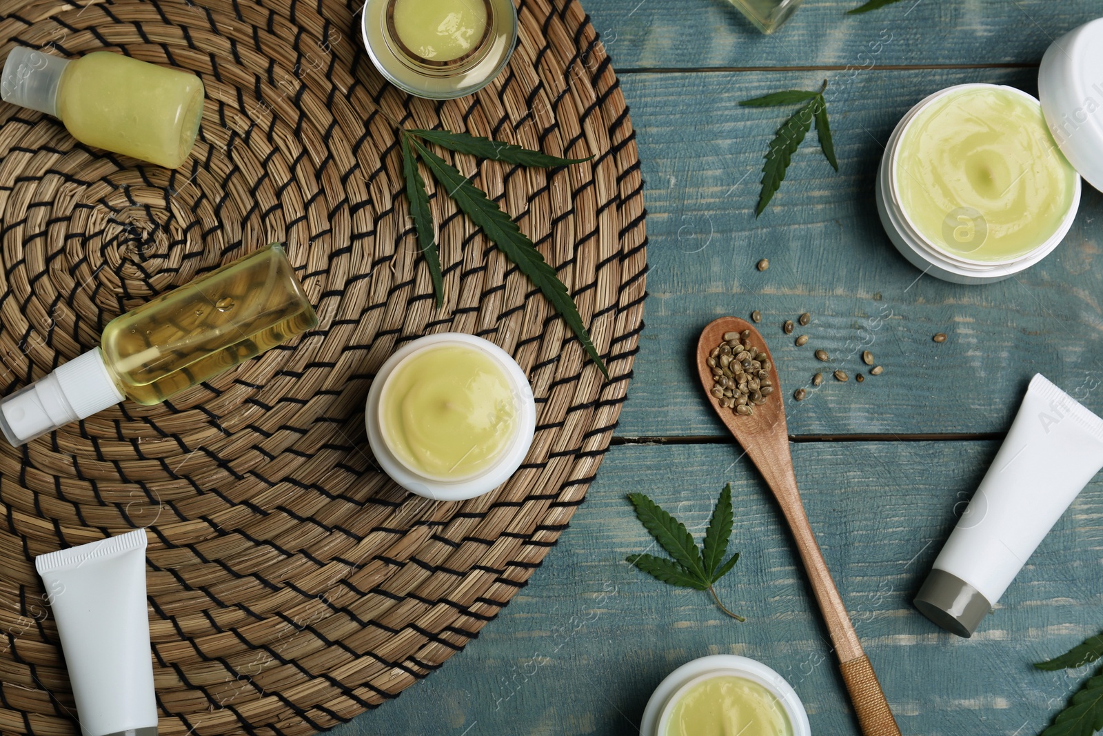 Photo of Flat lay composition with hemp lotion on wooden background