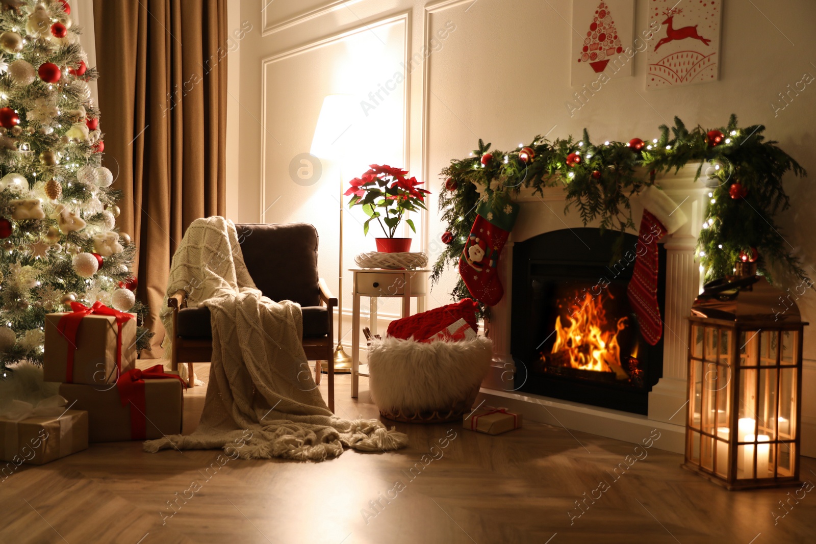 Photo of Stylish room interior with fireplace and beautiful Christmas tree