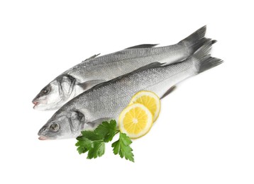 Photo of Fresh sea bass fish, lemon and parsley on white background, top view