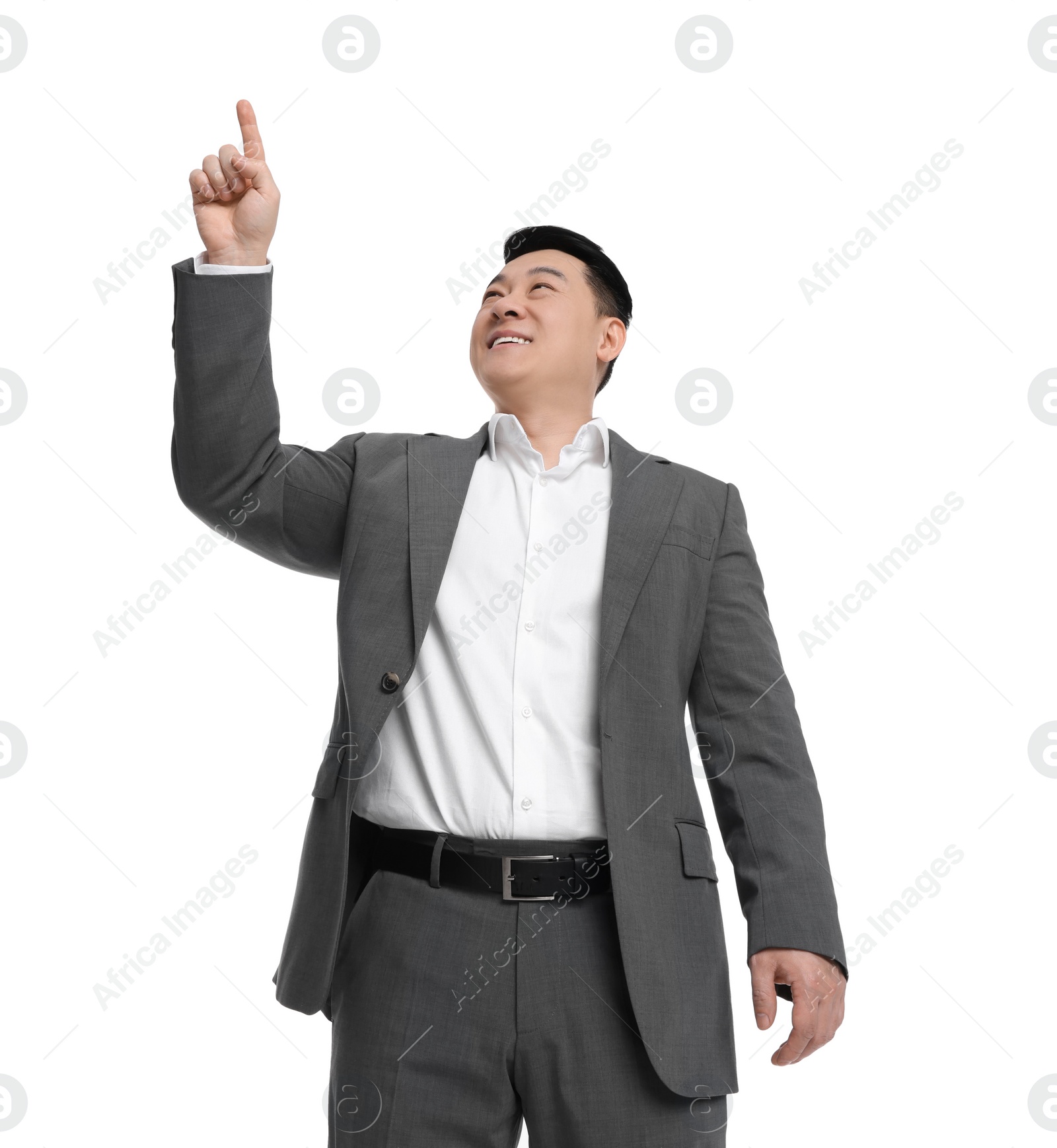 Photo of Businessman in suit posing on white background, low angle view