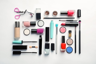 Flat lay composition with decorative cosmetics on white background