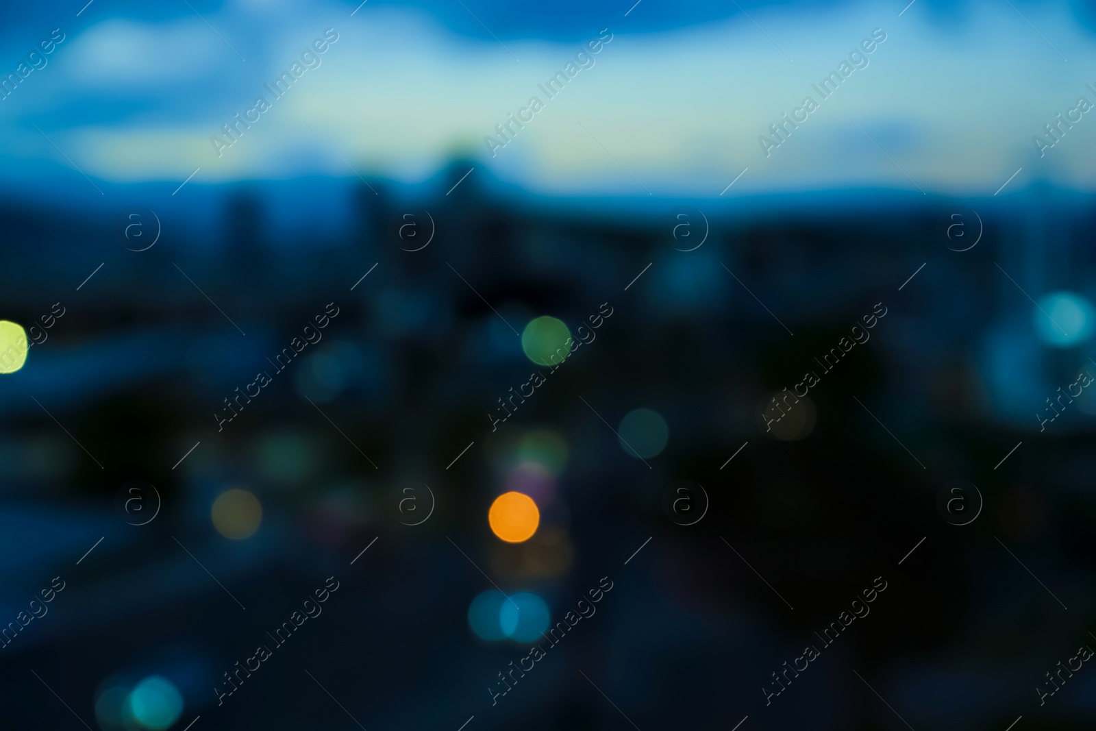 Photo of Blurred view of cityscape in evening. Bokeh effect