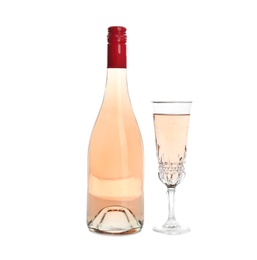 Bottle and glass with rose champagne on white background. Festive drink