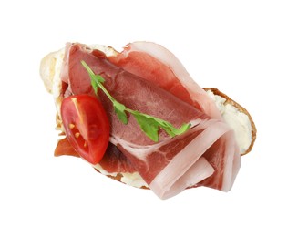 Photo of Tasty sandwich with cured ham, arugula and tomato isolated on white, top view