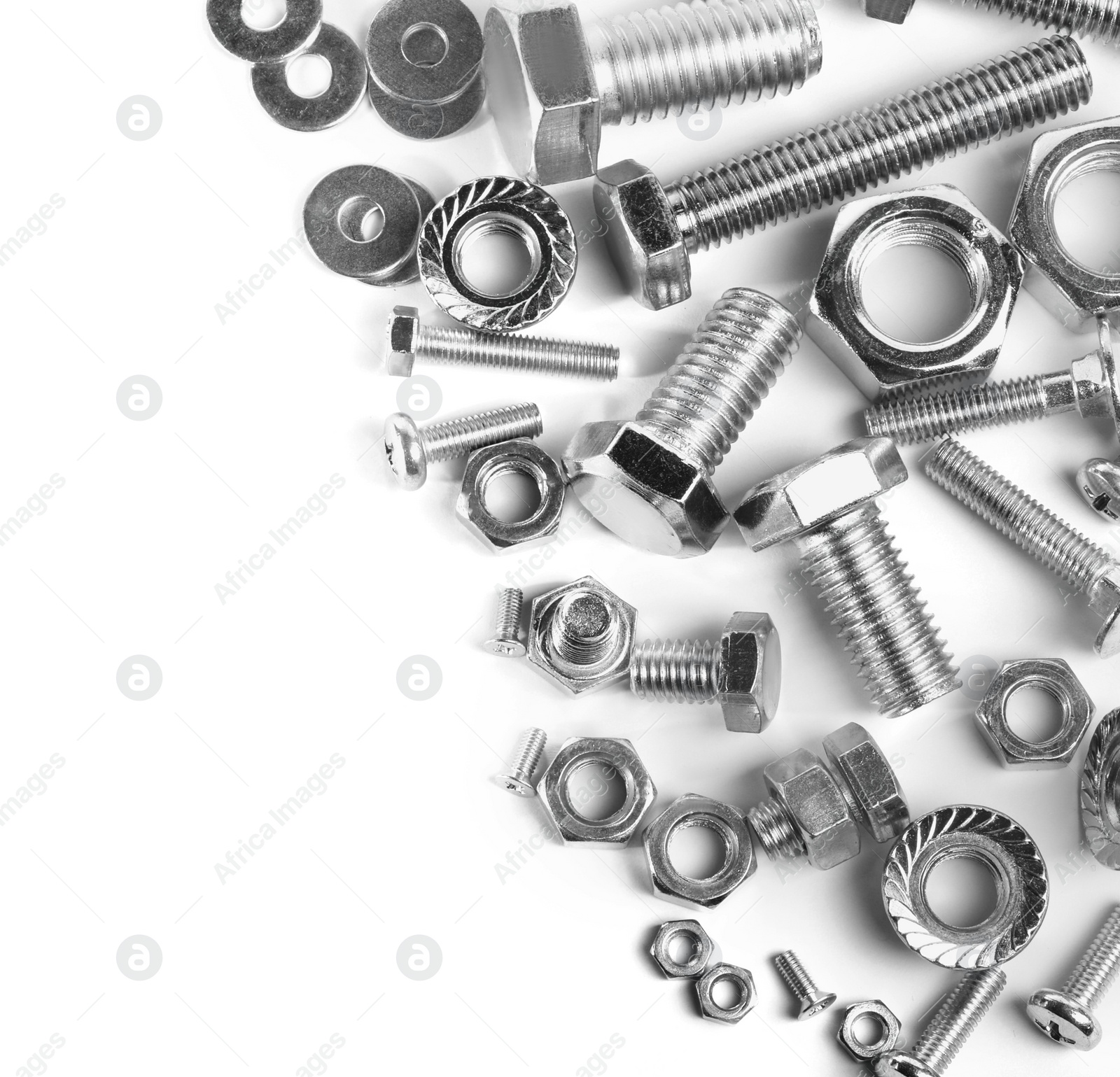 Photo of Different metal bolts and nuts on white background, top view