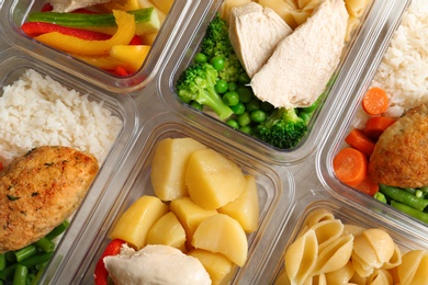 Boxes with prepared meals as background, flat lay