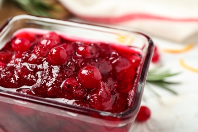 Delicious cranberry sauce in bowl, closeup view