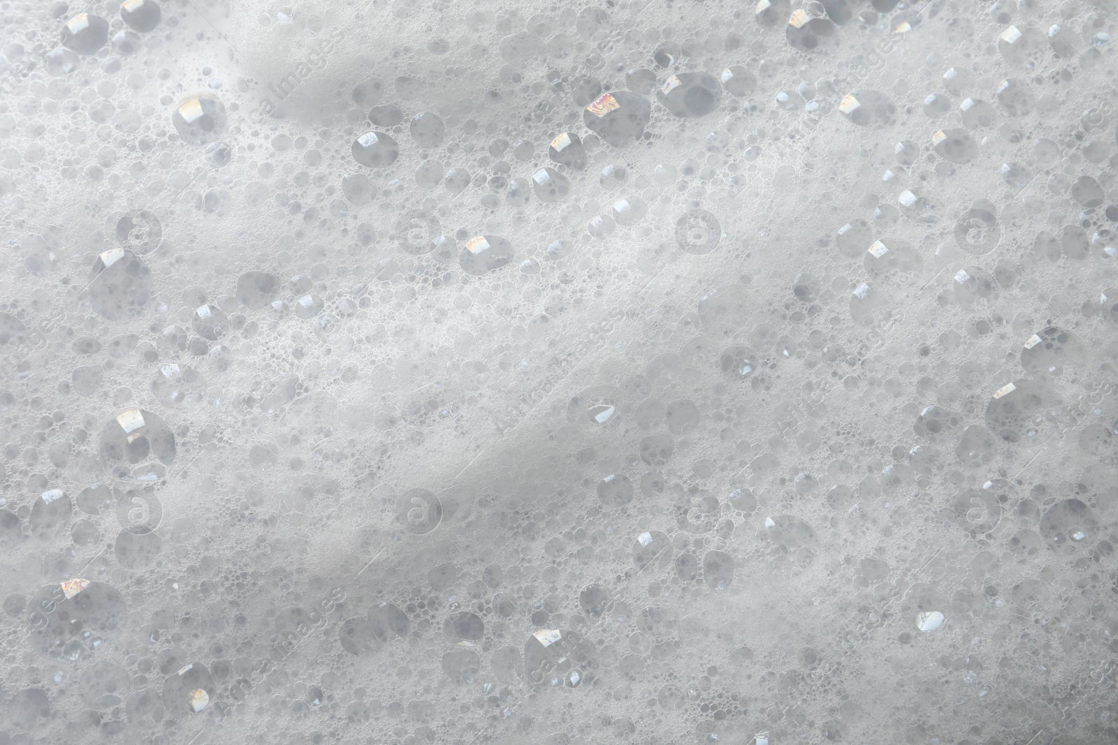 Photo of Fluffy soap foam as background, closeup view