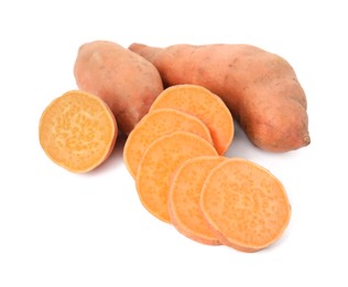 Whole and cut ripe sweet potatoes on white background