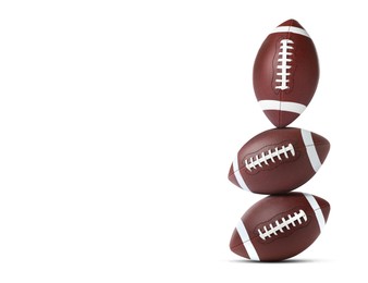 Image of Stack of American football balls on white background. Space for text