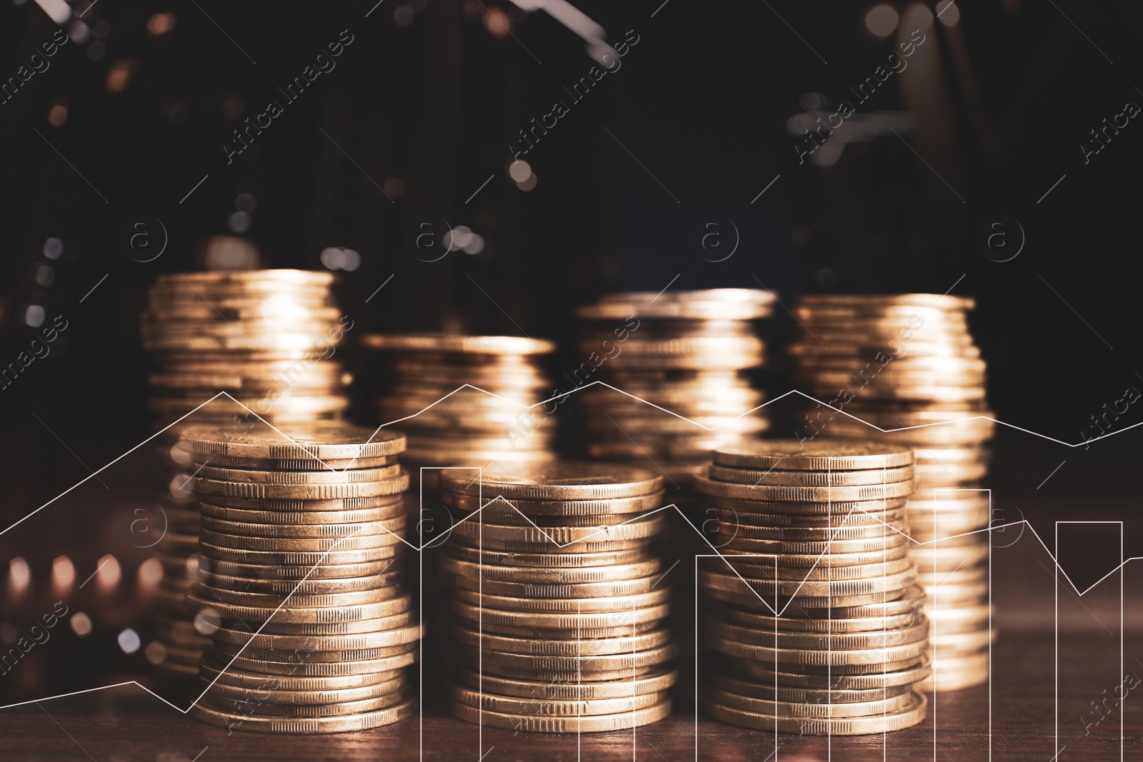 Image of Stacked coins on wooden table and illustration of charts  