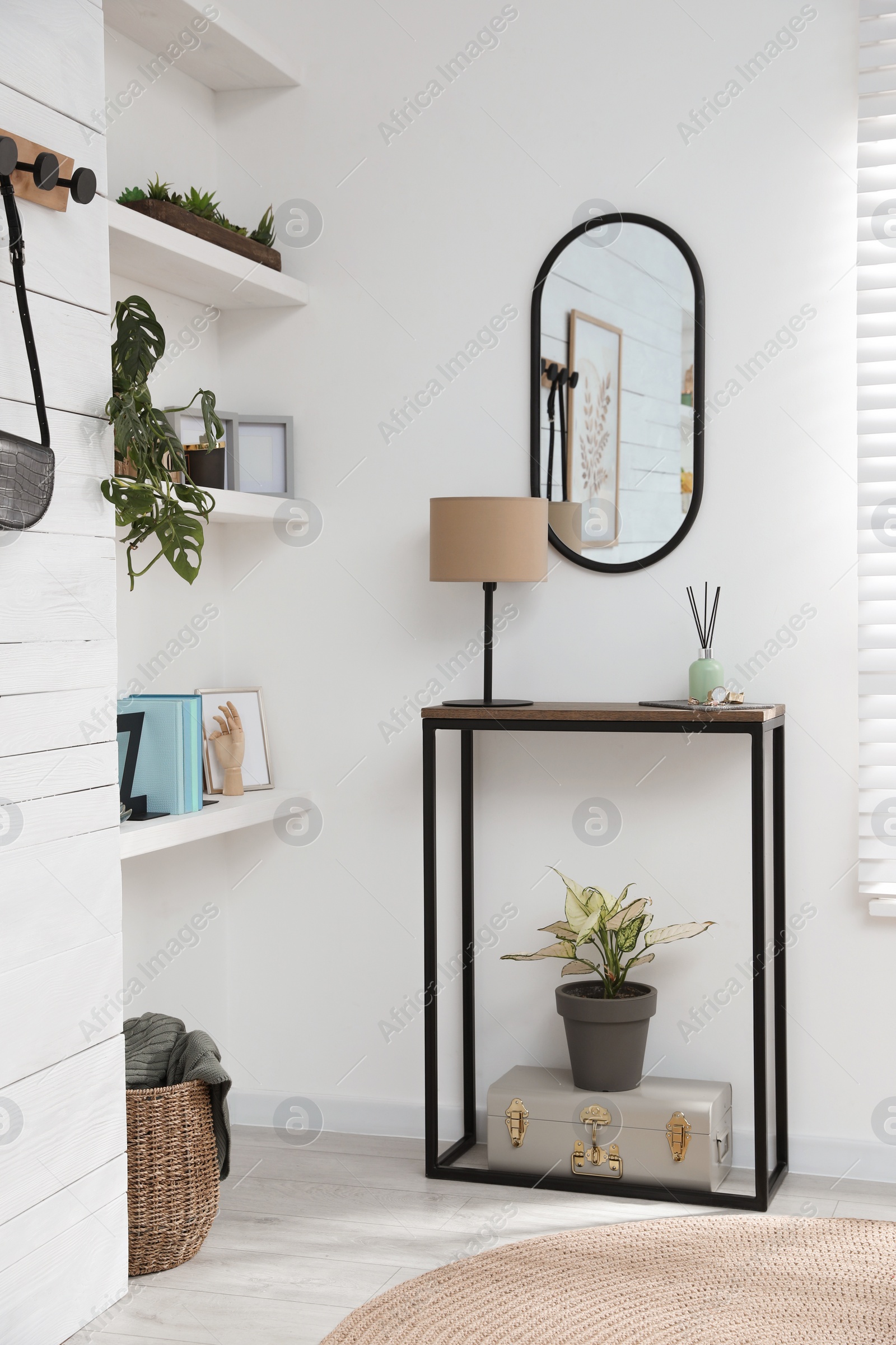 Photo of Hallway interior with console table and stylish decor