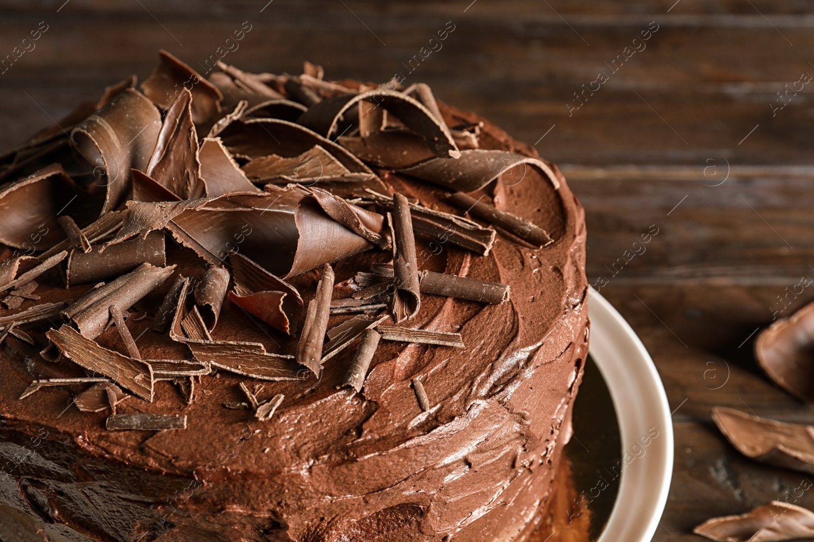 Photo of Tasty homemade chocolate cake on plate, closeup