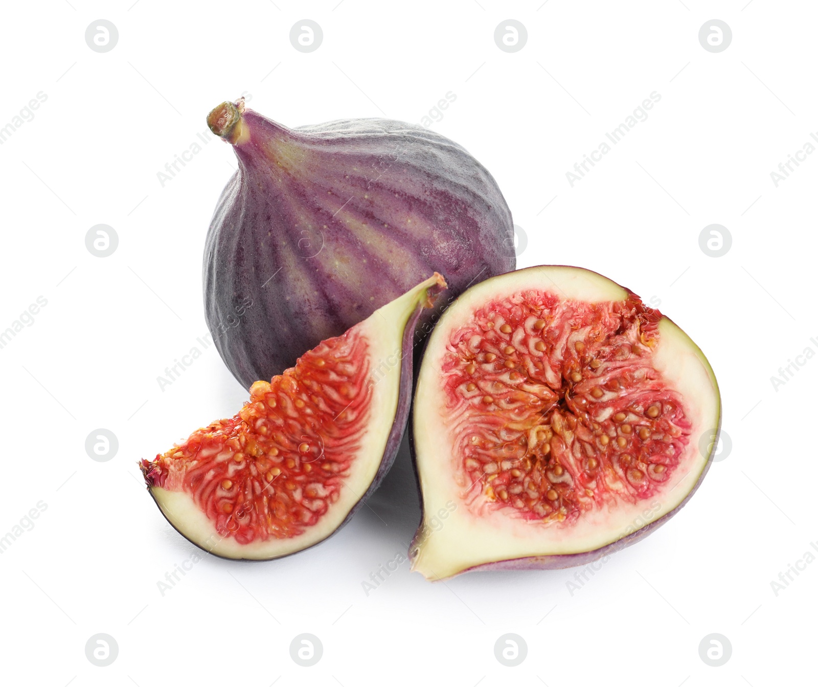 Photo of Whole and cut purple figs on white background