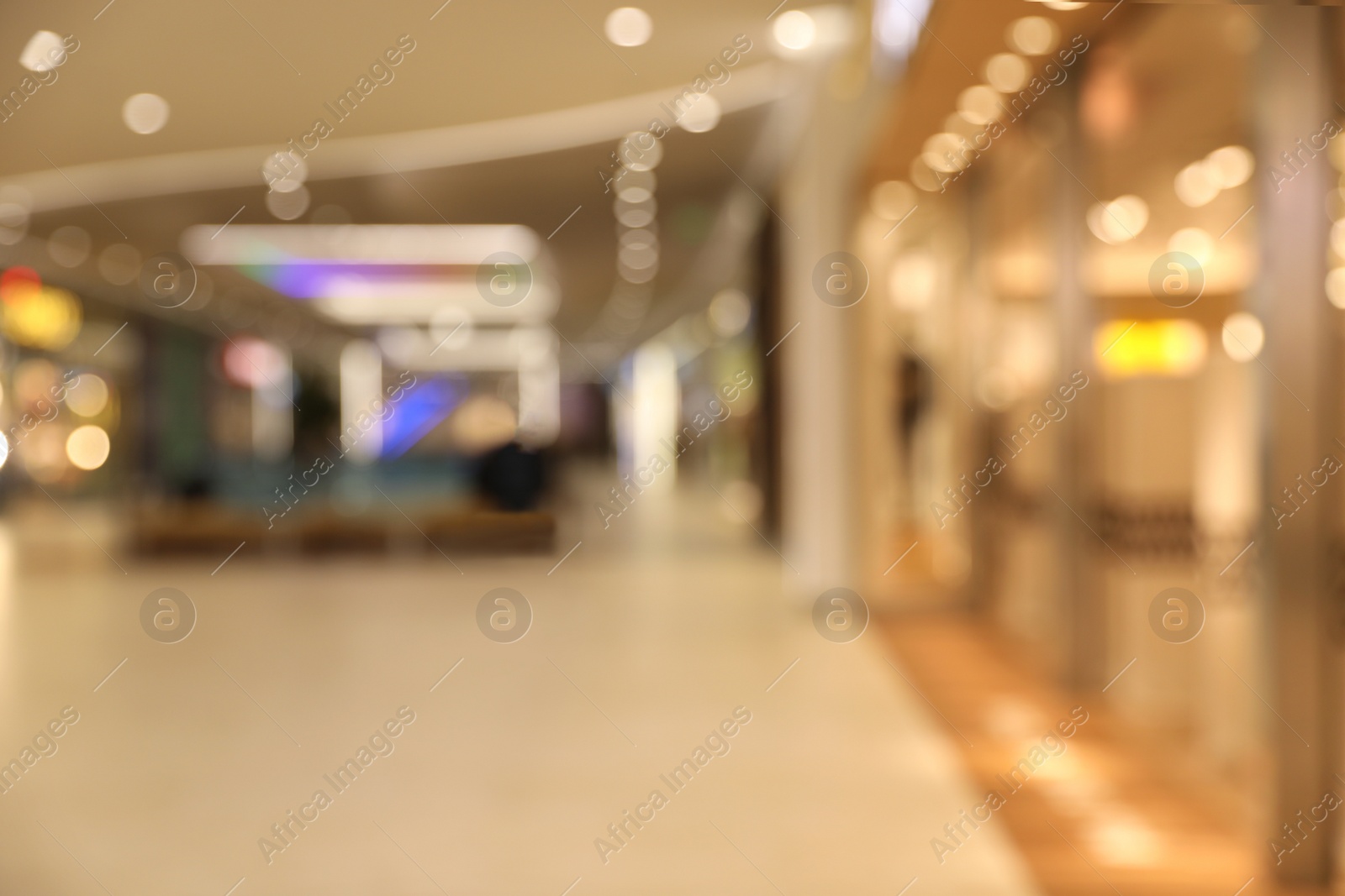 Photo of Blurred view of modern shopping mall interior. Bokeh effect